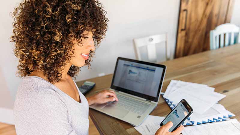 woman-managing-investments-on-smart-phone-sm.jpg